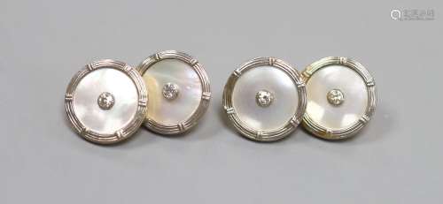 A pair of 18ct, mother of pearl and diamond set disc cufflin...