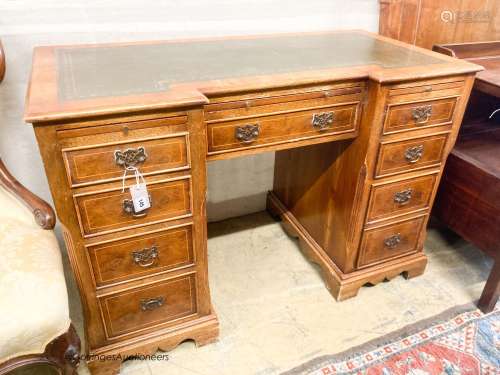 A reproduction yew inverse breakfront kneehole pedestal desk...