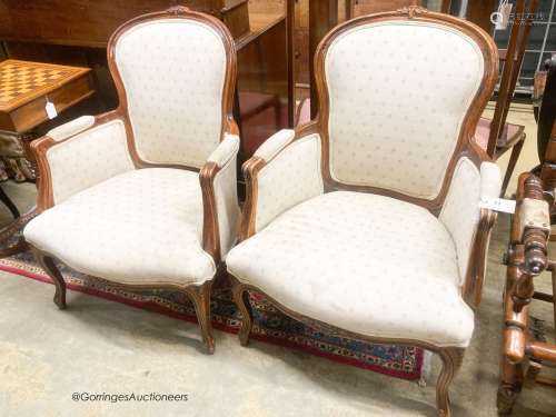 A pair of Louis XV style mahogany fauteuils, width 66cm, dep...
