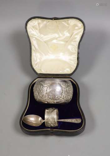 A Victorian cased matched embossed silver christening trio, ...