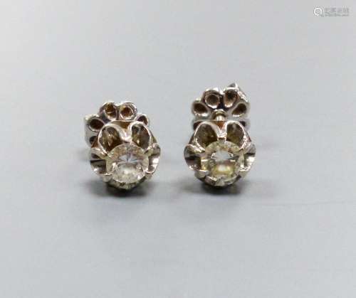 A pair of white metal and solitaire diamond set ear studs, e...