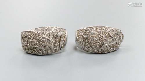 A modern pair of 18k white metal and pave set diamond demi-l...