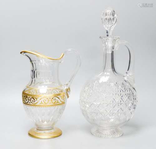 A Baccarat gilt and cut glass jug and a strawberry cut glass...