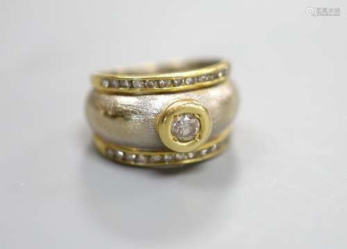 A modern texture white metal and single stone diamond ring, ...