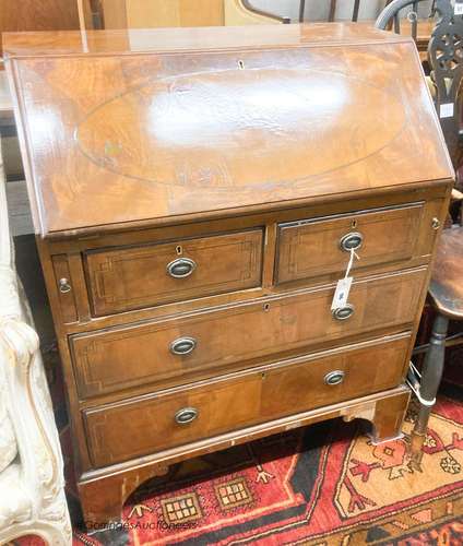 An early 20th century walnut bureau, width 66cm, depth 45cm,...