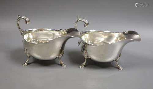 A pair of Edwardian silver sauceboats, with flying scroll ha...