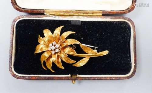 An early 1970's 18ct gold and seven stone diamond set flower...