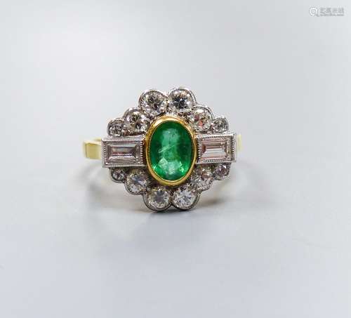 A modern 18ct gold, emerald, baguette and round cut diamond ...