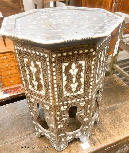 A Middle Eastern mother of pearl and bone inlaid octagonal t...