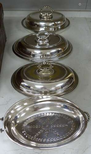 A pair of plated entrée dishes and covers and a similar entr...