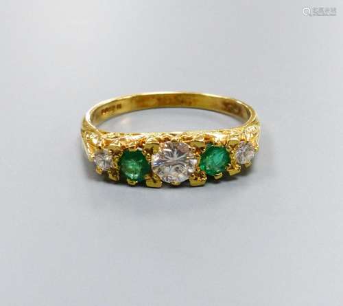 A modern Victorian style 18ct gold, three stone diamond and ...