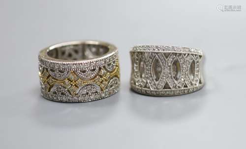 Two modern pierced yellow and white metal, diamond chip clus...