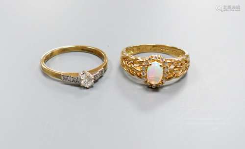 A modern 9ct gold, white opal and diamond set oval cluster r...