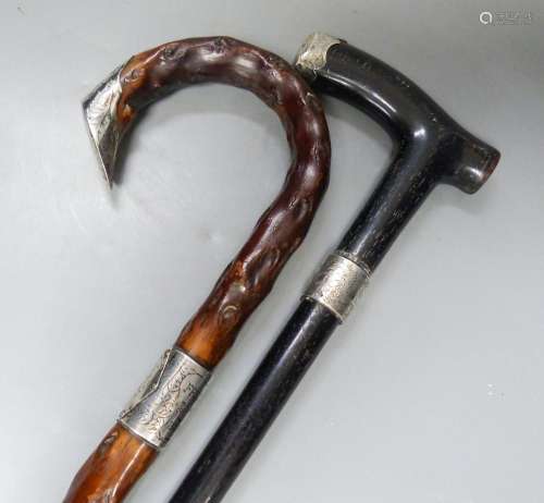 Two Victorian silver mounted walking sticks, longest 92.5 cm