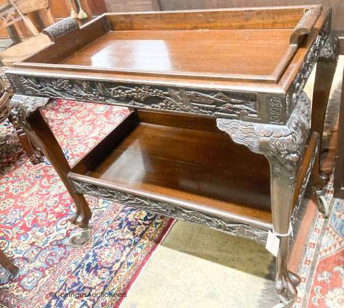 A Chinese carved hardwood tea trolley, with removable tray, ...