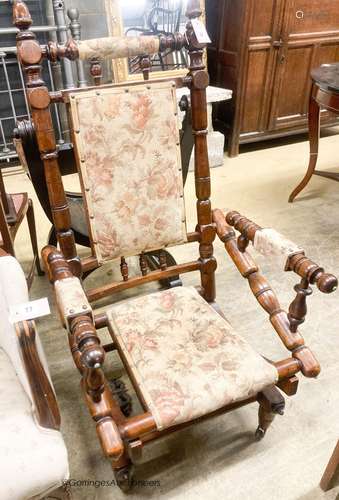 An early 20th century American turned mahogany rocking chair