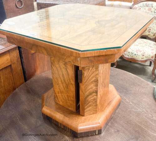 An Art Deco style octagonal figured walnut coffee table, wit...