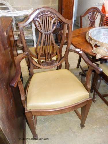 A set of six Hepplewhite style mahogany dining chairs, two w...