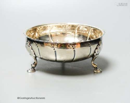 A Victorian repousse silver bowl, on three hoof feet, London...