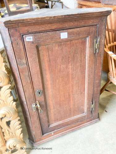 An 18th century oak hanging corner cupboard, width 70cm, dep...