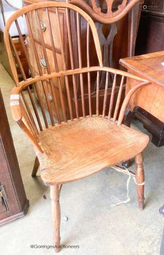 An early 19th century yew and elm Windsor elbow chair, width...