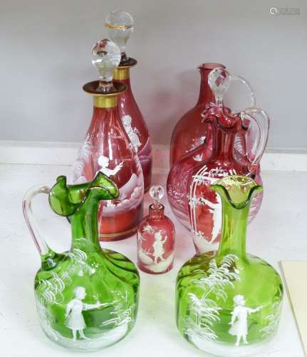 A collection of Mary Gregory cranberry and green glass decan...