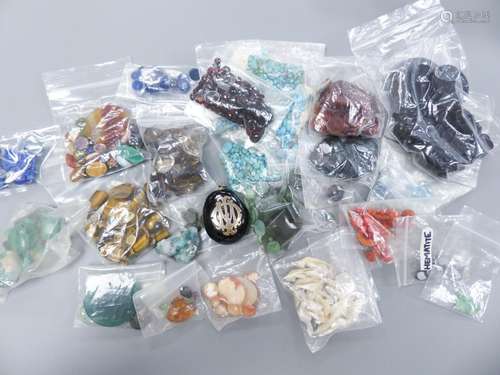 A quantity of assorted unmounted gemstones including, opal, ...