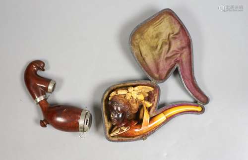 A Victorian Meerschaum pipe modelled as a lady, 13.5cm long,...