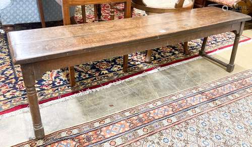 An 18th century style oak low bench seat, length 140cm, dept...