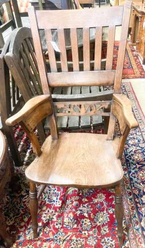 An early Victorian elm and beech Windsor armchair, width 54c...