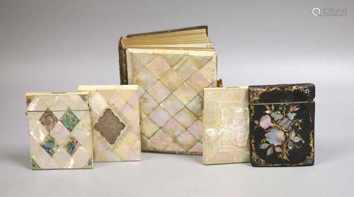 Three Victorian mother of pearl card cases, a papier mache c...