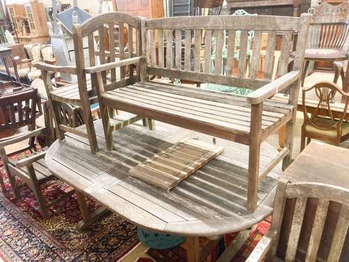 A weathered teak extending garden table, length 190cm, depth...