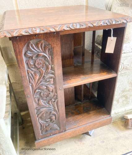 An early 20th century carved oak revolving bookcase, length ...