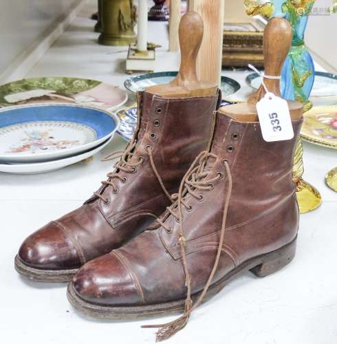 A pair of tan leather boots with trees