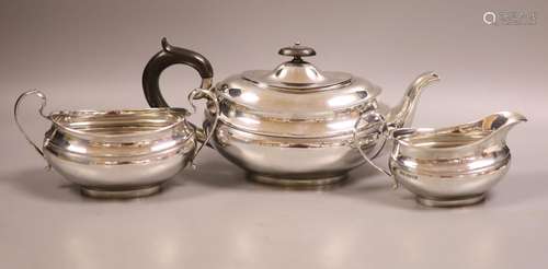 A George VI three-piece silver tea service, oval form, Sheff...