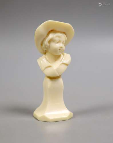 A carved ivory bust of a boy wearing a hat, early 20th centu...