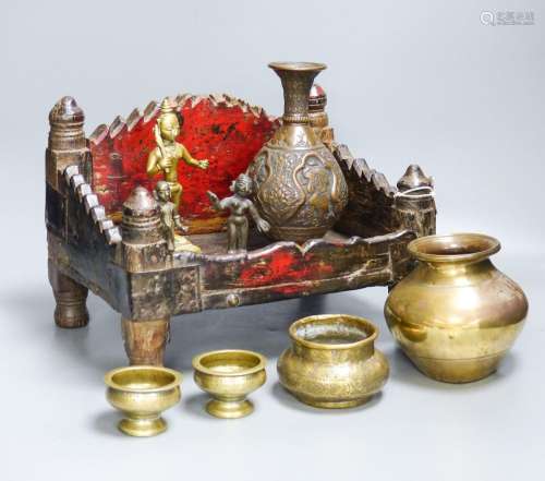 An Indian shrine stand, metalware figures and vessels (9), s...