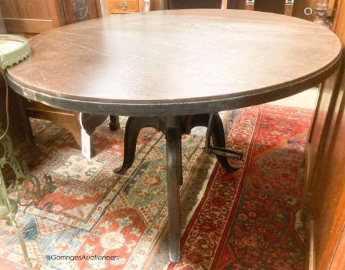 An industrial style circular oak adjustable table, diameter ...