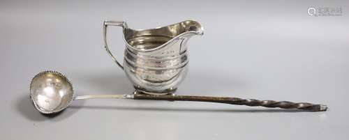 A George III silver cream jug, marks rubbed, height 10.7cm, ...