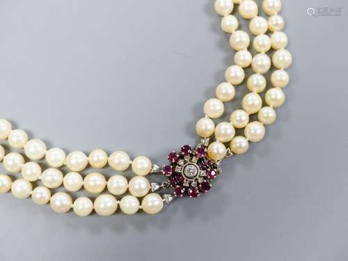 A triple strand cultured pearl necklace, with 585 white meta...