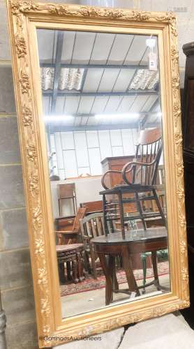 A rectangular carved giltwood framed wall mirror, width 67cm...