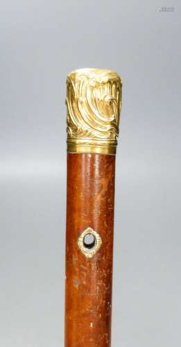 A long George III gold mounted malacca cane, 110.5 cm