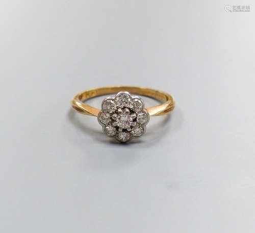 An 18ct & plat, circular diamond cluster set ring, size M/N,...