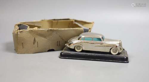 A Prameta clockwork Mercedes Benz 300, with base, 16cm long,...