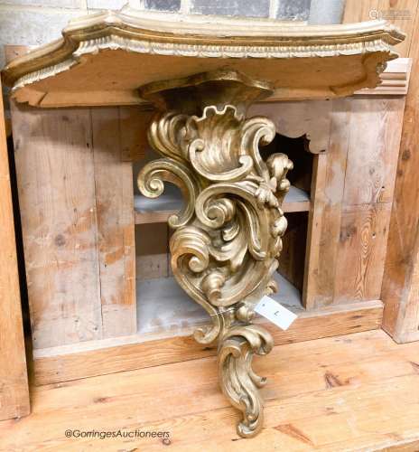 An Italian carved pine gilt console table, width 66cm, depth...