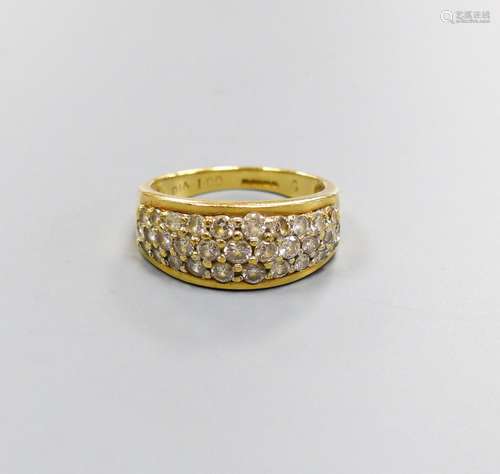 A modern 18ct gold and diamond encrusted half hoop ring, tot...