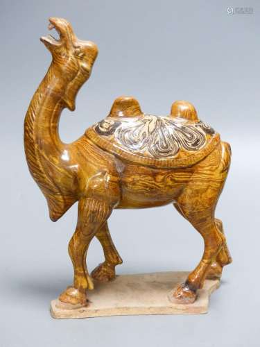 A Chinese Tang style jiaotai glazed pottery figure of a bact...