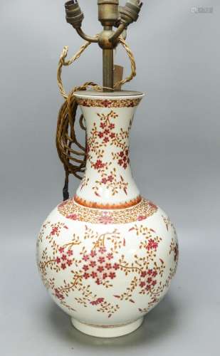 A Chinese famille rose ‘prunus’ vase, four character Qianlon...
