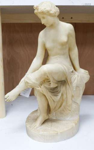 A 19th century Italian carved alabaster figure of a seated l...