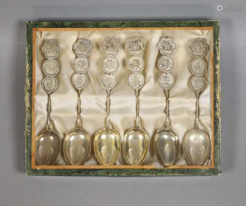 A set of six Chinese white metal spoons, with Chinese charac...